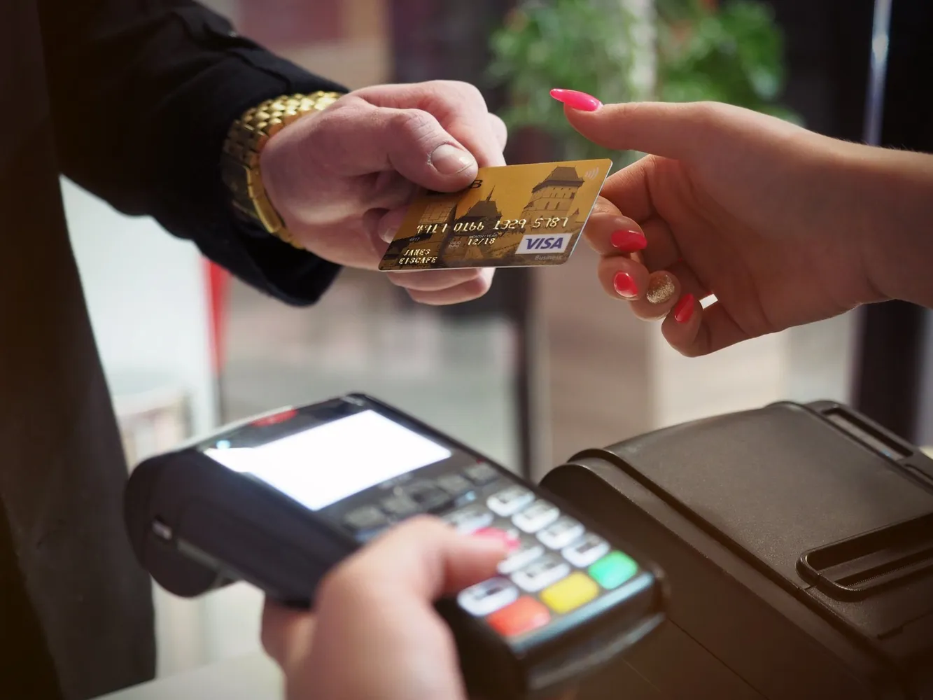 Hand-off of a payment card between customer and merchant